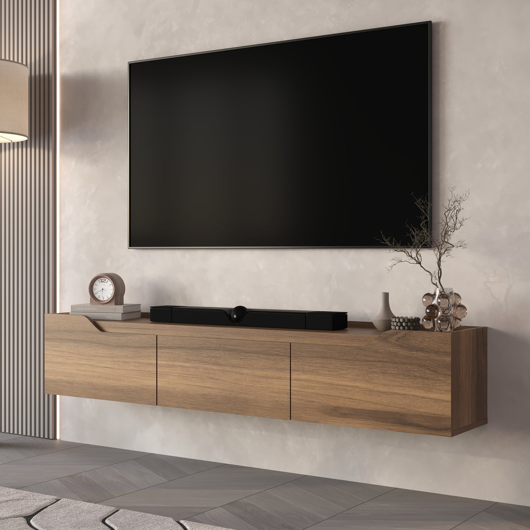 Wooden TV stand with a large flat-screen TV mounted on the wall in a modern living room.
